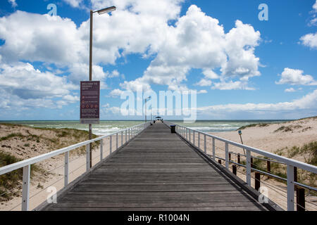 The grange jetty with a blue sky and white fluffy clouds at Grange South Australia on 7th November 2018 Stock Photo