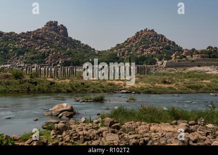 Bridge Pillars at River Krishna, Hampi, Karnataka, India Stock Photo