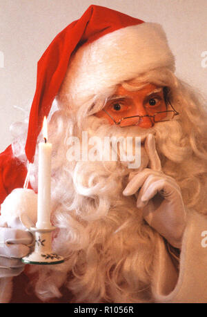 Santa Claus gesturing silence, USA Stock Photo