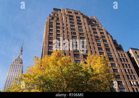 The Empire State Building and Ten Park Avenue in Murray Hill with a clear blue sky on an autumn day, NYC, USA Stock Photo