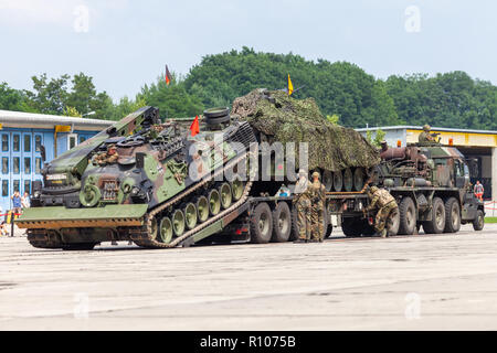 BURG / GERMANY - JUNE 25, 2016: German armored recovery vehicle, Bergepanzer 2 from Bundeswehr pulls a damaged tank at open day in barrack Burg / Saxo Stock Photo