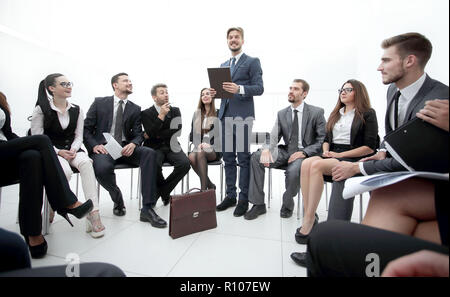 coach leads the session with the business team. Stock Photo