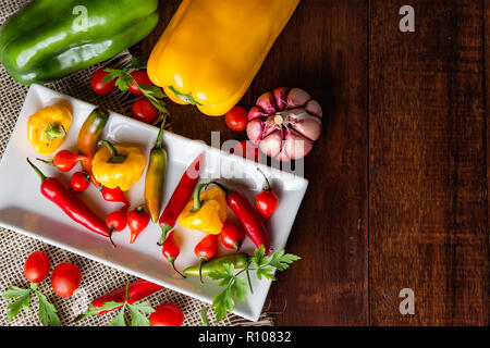 mix of peppers with tomato, garlic and olive oil. Stock Photo