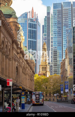 Central Sydney street view along George street to Sydney Town Hall with historic Queen Victoria Building to left, Sydney, NSW, Australia Stock Photo