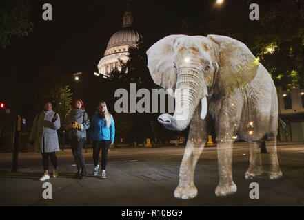 WWF Hologram - Elephant crosses the road in London  It's time to address the elephant in the road. WWF uses hologram and imaginative animal crossings to show Londoners how they can prevent illegal wildlife trafficking.  Featuring: Atmosphere Where: London, United Kingdom When: 08 Oct 2018 Credit: Joe Pepler/PinPep/WENN.com Stock Photo