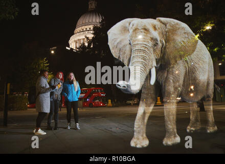 WWF Hologram - Elephant crosses the road in London  It's time to address the elephant in the road. WWF uses hologram and imaginative animal crossings to show Londoners how they can prevent illegal wildlife trafficking.  Featuring: Atmosphere Where: London, United Kingdom When: 08 Oct 2018 Credit: Joe Pepler/PinPep/WENN.com Stock Photo