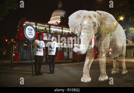 WWF Hologram - Elephant crosses the road in London  It's time to address the elephant in the road. WWF uses hologram and imaginative animal crossings to show Londoners how they can prevent illegal wildlife trafficking.  Featuring: Atmosphere Where: London, United Kingdom When: 08 Oct 2018 Credit: Joe Pepler/PinPep/WENN.com Stock Photo