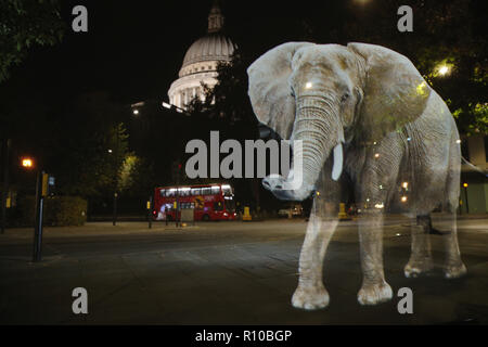 WWF Hologram - Elephant crosses the road in London  It's time to address the elephant in the road. WWF uses hologram and imaginative animal crossings to show Londoners how they can prevent illegal wildlife trafficking.  Featuring: Atmosphere Where: London, United Kingdom When: 08 Oct 2018 Credit: Joe Pepler/PinPep/WENN.com Stock Photo