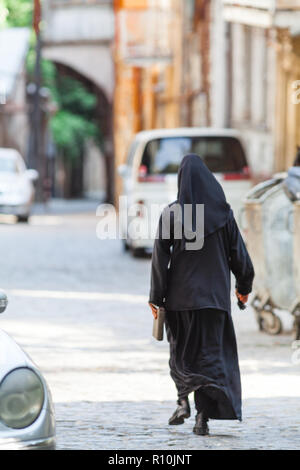 Christian nuns walking down the street Stock Photo