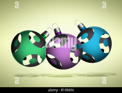 Close up of three Christmas baubles floating against a plain background Stock Photo