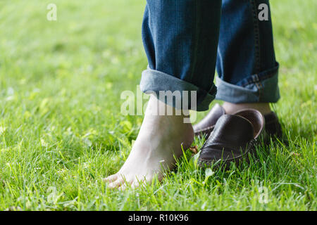 feet of the man barefoot in the Park Stock Photo