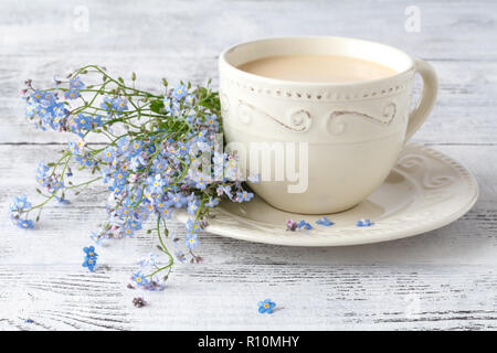 Forget-me-nots Flowers In Cup, On Blue Background Stock Photo - Alamy