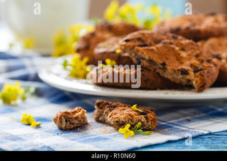Homemade oatmeal cookies folded in a pile on the old table Stock Photo