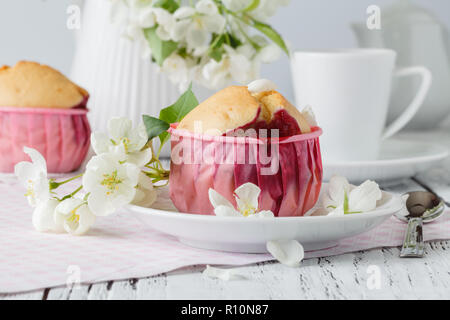 Cake on the background of the cherry blossoms Stock Photo
