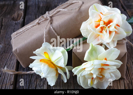 white daffodil flowers on old wood table background Stock Photo