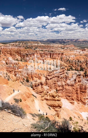 Hikers amongst hoodoo formations on the Sunrise Point Trail in Bryce Canyon National Park, Utah, USA. Stock Photo