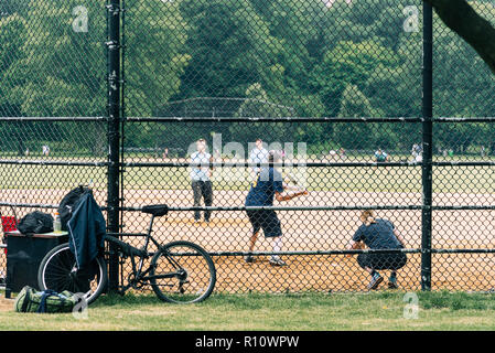 New York City, USA - June 23, 2018: Softball teams playing at Heckscher Ballfields in Central Park. It consist of six baseball and softball fields Stock Photo