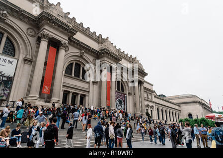 New York City, USA - June 23, 2018: Crowd of people at the main entrance of Metropolitan Museum of Art of New York a cloudy day Stock Photo