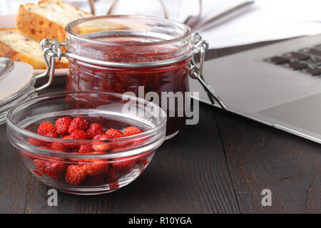 Healthy breakfast overnight oats with fresh berries in a glass jar Stock Photo