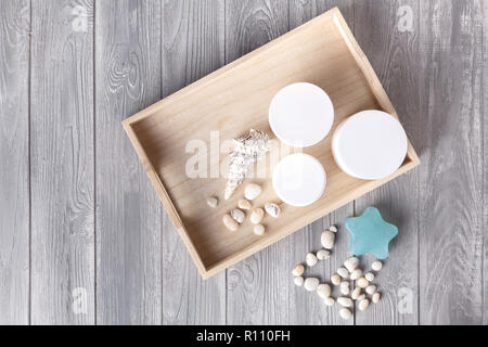 Various spa related objects on gray background, top view. Body and skin care Stock Photo