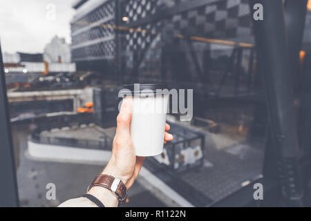 The coffee cup on the way to work. Stock Photo