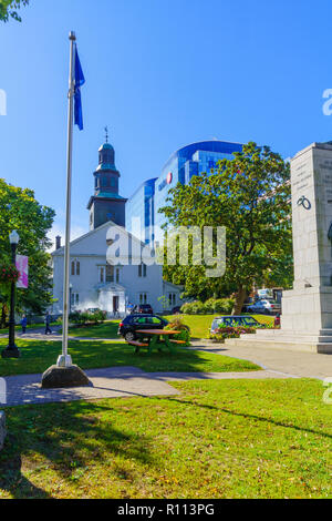 Halifax, Canada - September 23, 2018: View of the grand parade square with the St. Pauls Anglican Church, locals and visitors, in Halifax, Nova Scotia Stock Photo