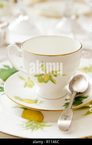 Tea cup painted with fruit Stock Photo