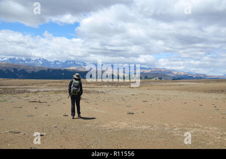 Walking across a mountainous plateau, Guadal, Chile Stock Photo