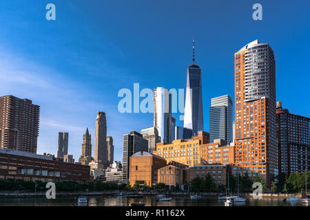 View of the sunrise over the skyscrapers in Tribeca from Pier 25, Manhattan, NYC Stock Photo