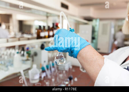 A scientist in laboratory analyzing water sample Stock Photo