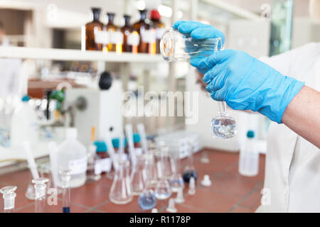A scientist in laboratory analyzing water sample Stock Photo
