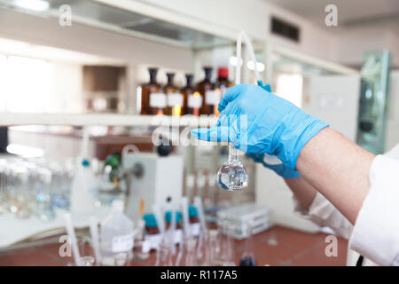 A scientist in laboratory analyzing water sample Stock Photo