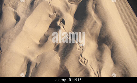 Footprints in the sand Stock Photo