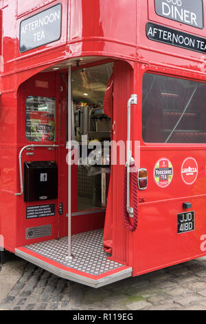 A converted London bus serving street food at the Royal Albert Dock in Liverpool Stock Photo