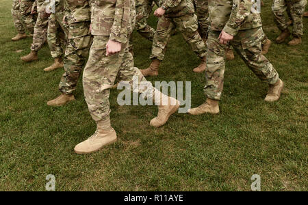 US soldiers legs in green camouflage military uniform. US troops Stock Photo
