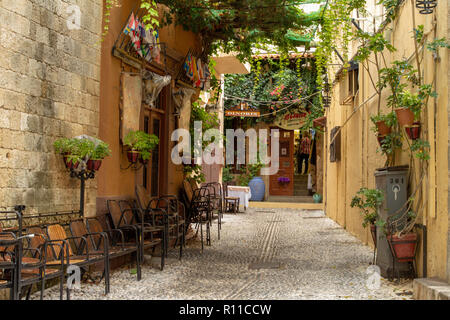 One of the many colourful alleyways in the Old Town of Rhodes, Greece, a UNESCO Heritage Centre.. Stock Photo