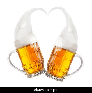Two mugs of beer with splashes of foam in shape of heart Stock Photo