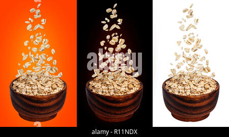 Oat flakes falling in bowl, isolated on white, black, color backgrounds, flying oats packaging concept, oatmeal grains Stock Photo