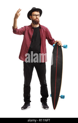 Full length portrait of a male hipster holding a longboard and gesturing peace with fingers isolated on white background Stock Photo