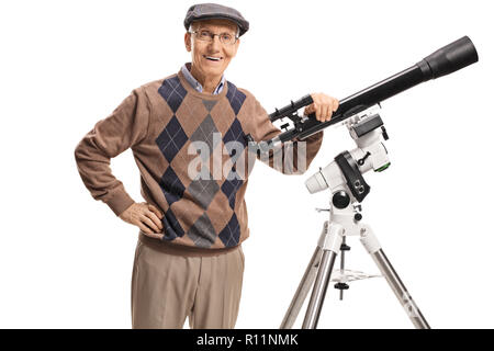 Smiling senior man with a telescope looking at the camera isolated on white background Stock Photo