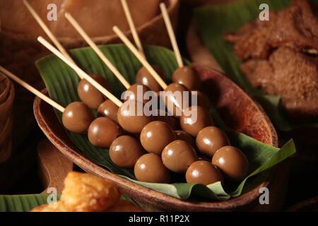 Sate Telur Puyuh. Satays of quail eggs braised in soy sauce. Stock Photo