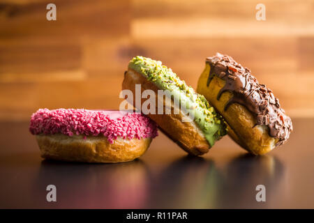 Three sweet glazed donuts. Stock Photo