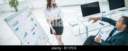 business partners discussing a new financial strategy. Stock Photo