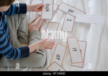 Learning to read with flash cards Stock Photo