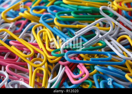 pile of colored office paper clips Stock Photo