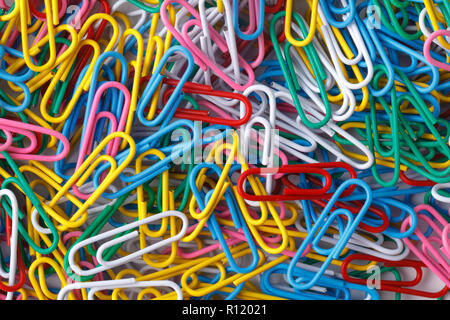 pile of colored office paper clips Stock Photo