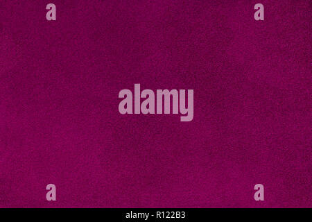 Dark purple matte background of suede fabric, closeup. Velvet texture of seamless wine leather. Felt materisl macro. Stock Photo
