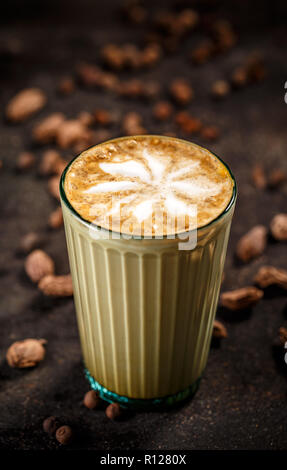 Oriental flavoured coffee latte on vintage dark background Stock Photo