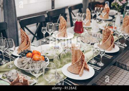 Wedding decorated table. Table set for an event party or wedding reception Stock Photo