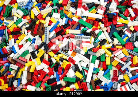 Multicolored plastic building blocks of the designer. Background of bright plastic building blocks. Stock Photo